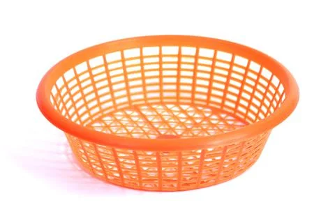 Orange Round Plastic Basket, note select focus with shallow depth of field Stock Photos