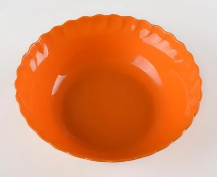 Orange round plastic deep dish Stock Photos