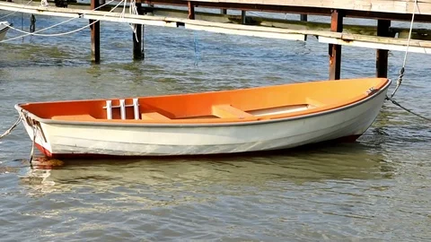 Orange rowboat Stock Footage 90988386