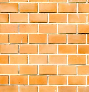 Orange ruled brick wall texture background Stock Photos