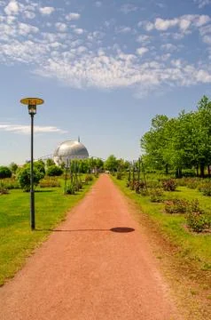 Orange running and walking path in the city park in Magdeburg, Germany, summe Stock Photos