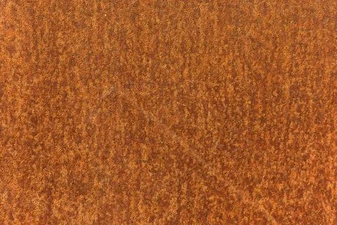 Orange rusted metal texture background, close up of corroded steel sheet Photos
