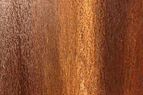 Orange rusted metal texture background, close up of corroded steel sheet Fotos Stock