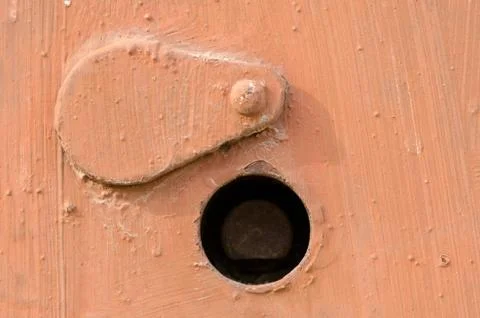Orange rusty doors texture. switchboard cover with keyhole. Stock Photos