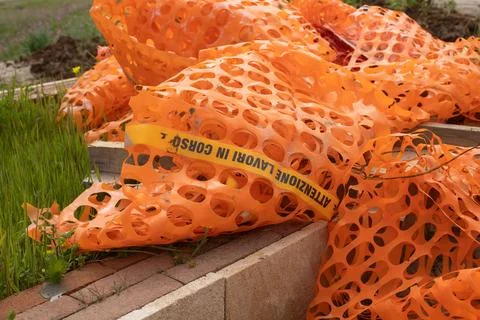 Orange safety net marking work in progress in Italy 写真素材