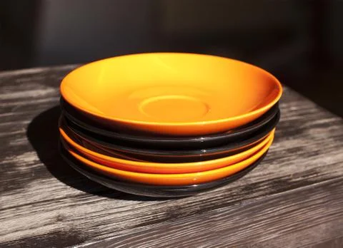 Orange saucer on the table Stock Photos