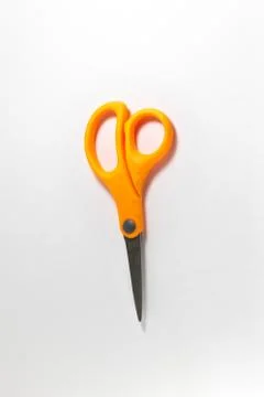 Orange scissors Stock Photos