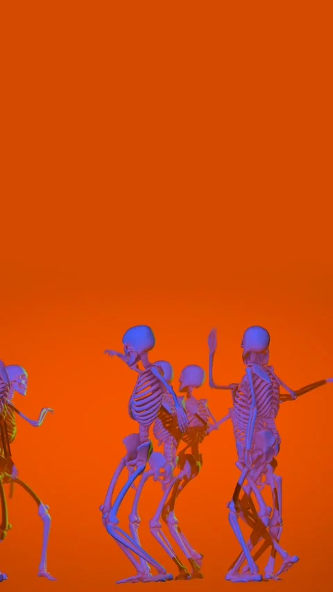 Orange seamless vertical video of skeletons with a sensual dance. Funny 動画素材 336911515