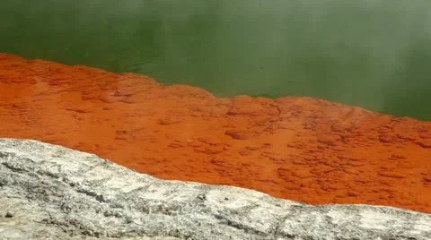 Orange sediments in thermal pool Stock Footage 25900607