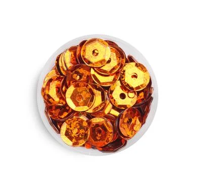 Orange sequins on white background, top view Stock Photos
