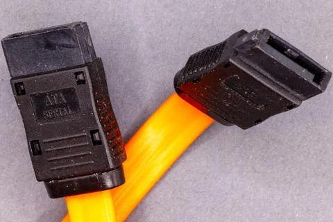 Orange serial ata cable connecting computer hardware components Stock Photos