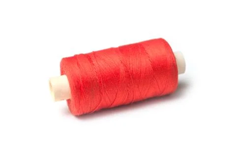 Orange sewing thread spool bobbin on white background Stock Photos