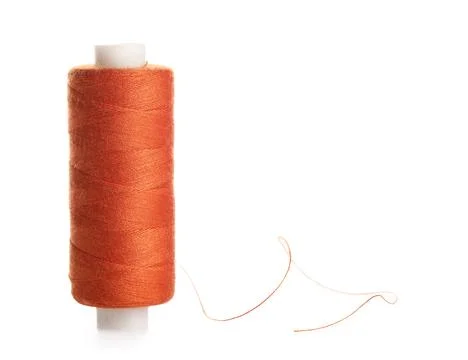 Orange sewing thread on white background Stock Photos