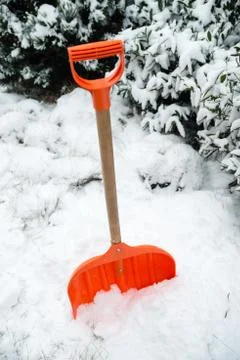 Orange shovel for snow removal Stock Photos