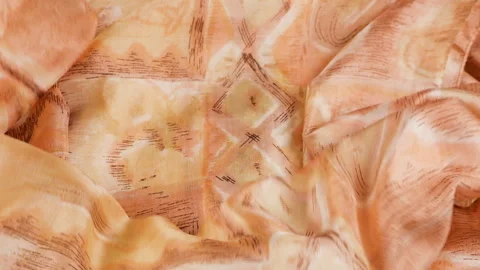 Orange silk fabric falls smoothly in slow motion. Video stock 337404716