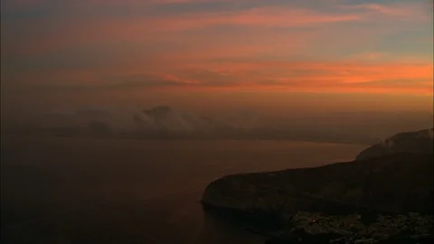 Orange sky after sunset over sea surface, Naples Bay Stock Footage 108573165