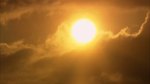 Orange sky and dark clouds at the sunset, Close up of sun in clouds Stock Footage 109437751