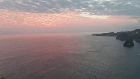 Orange Sky During Sunset and the Vast Ocean Waters in Indonesia Stock-Footage 133827994