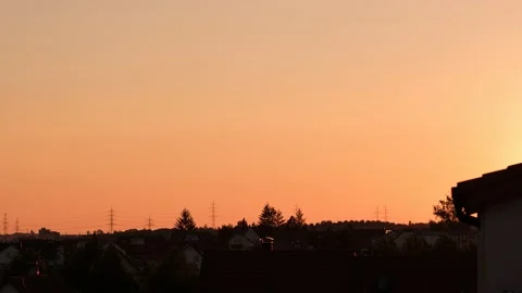Orange sky is turning into red in dusk evening time lapse Stock Footage 136950701