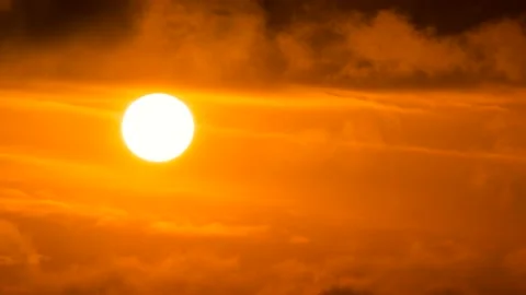 Orange sky, white sun, dark clouds - sunrise, sky background - Real Time - birds Stock Footage 152565794