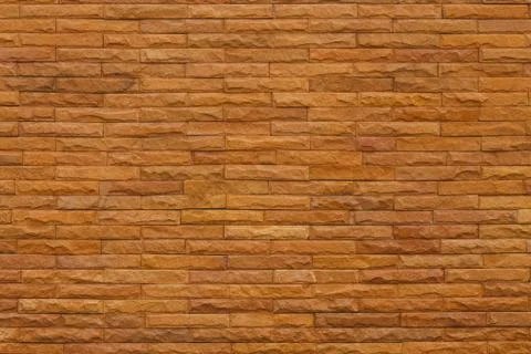 Orange slate stone wall for pattern and background Stock Photos