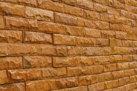 Orange slate stone wall for pattern and background Stock Photos