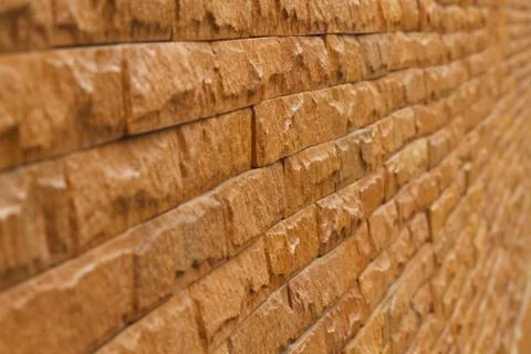 Orange slate stone wall for pattern and background Stock Photos