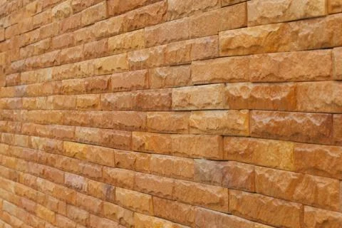 Orange slate stone wall for pattern and background Stock Photos