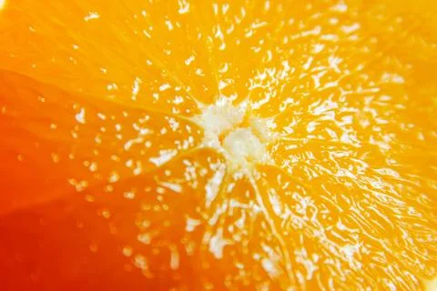 Orange slice and external part close up. Orange pulp and peel. macro image. Stock Photos