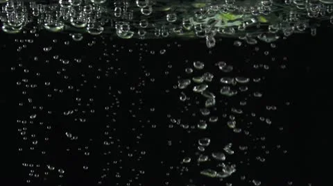 Orange slice falling in water Stock Footage 22244085