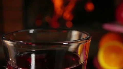 Orange slice falls into a beautiful mug of mulled wine Video stock 70481016