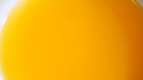 Orange slice falls in fresh juice Stock Footage 104506510