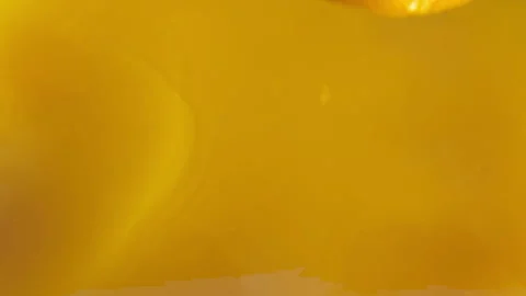 Orange slice falls in juice Stock Footage 88490608