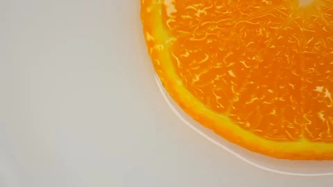 Orange slice fruit turn on a white background. Healthy eating concept, flat lay 動画素材 125885316
