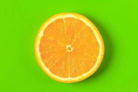 Orange slice on a green background macro. place for the label Foto stock