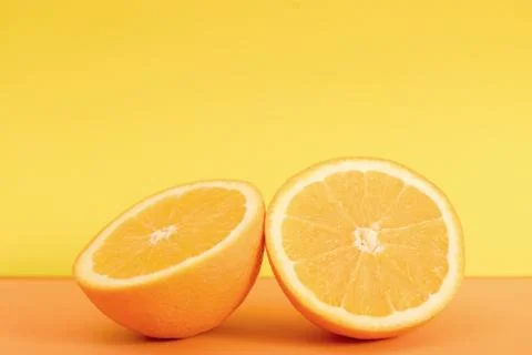 Orange slice isolated on orange background. Stock Photos