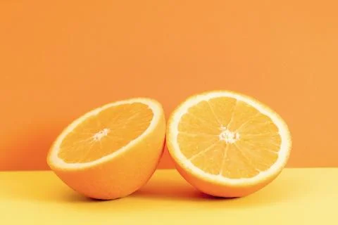 Orange slice isolated on orange background. Stock Photos