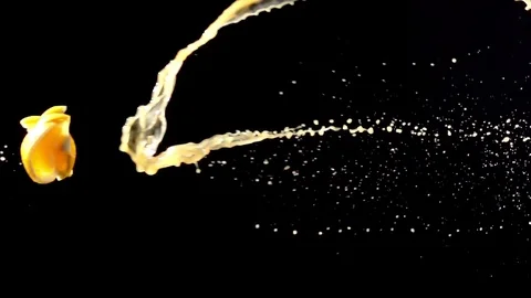 Orange slice with juice droplets collide on black background super slow motion Stock Footage 116959913