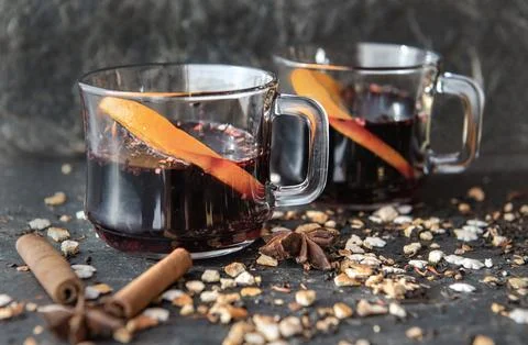 Orange slice in mulled wine in two glasses with heart-shaped cookies  and s.. Stock Photos