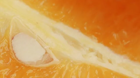 Orange slice segment close up rotating camera motion stock footage Stock Footage 337095411