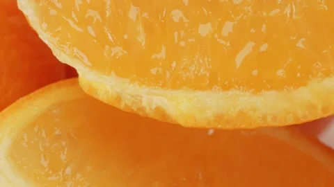 Orange slice segment close up rotating camera motion stock footage Video stock 337095422