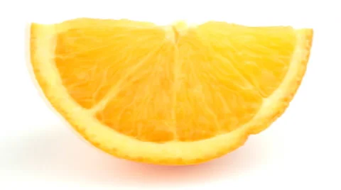Orange slice sliding in and out of view from top aerial then horizontal Stock Footage 47434863
