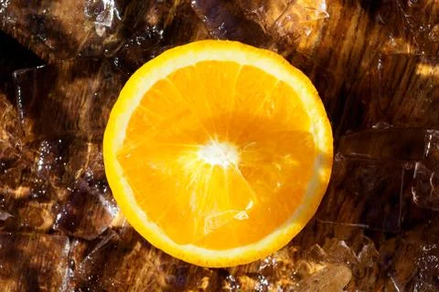 Orange slice on top of ice cubes Stock Photos