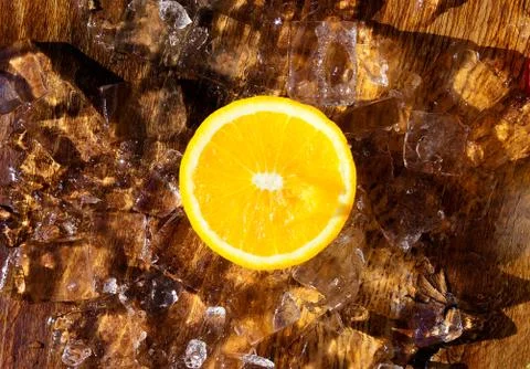 Orange slice on top of ice cubes Stock Photos