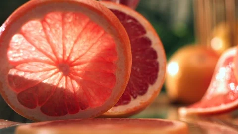 Orange slice tumbles over in slow motion Stock Footage 120461334