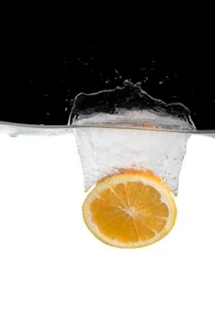 Orange slice in water Stock Photos