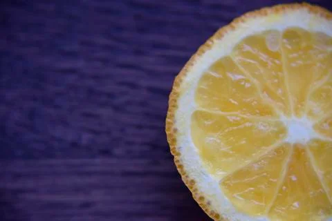 Orange slice on the wooden deck Stock Photos