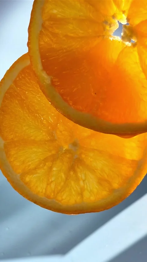 Orange sliced ​​close-up in motion Stock Footage 304665049