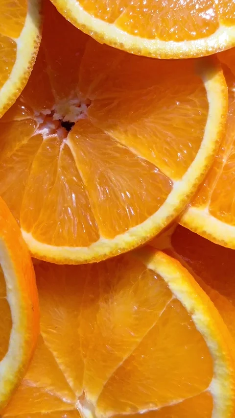 Orange sliced ​​close-up in motion Stock Footage 304665067