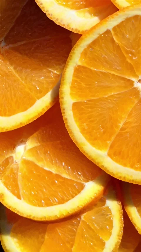 Orange sliced ​​close-up in motion Stock Footage 304665087